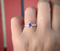 Elegant Amethyst engagement ring in Solid Sterling Silver showcased on a hand, highlighting its pear-shaped crystal and textured band.