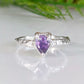 Handcrafted amethyst engagement ring in solid sterling silver with organic textured band.