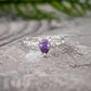 Amethyst engagement ring in solid sterling silver with pear-shaped gemstone on a textured band.