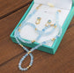Aquamarine and Opal bridal jewelry set featuring raw Aquamarine bead necklace and stud earrings in a gift box.