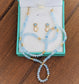 Aquamarine and Opal bridal jewelry set in display box, featuring stud earrings and a bead necklace.