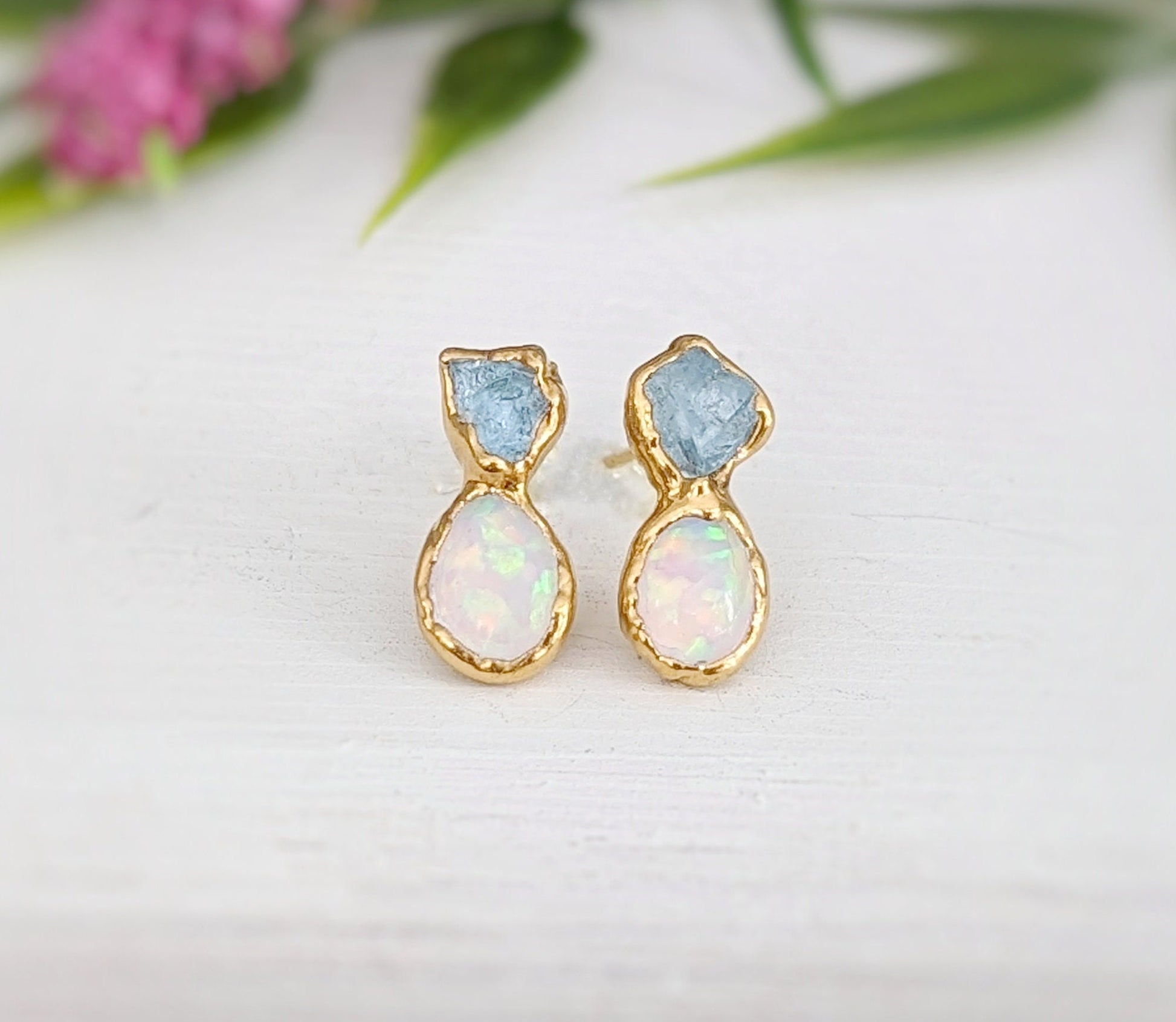 Handcrafted raw Aquamarine and Opal stud earrings in gold settings, perfect for bridal jewelry.