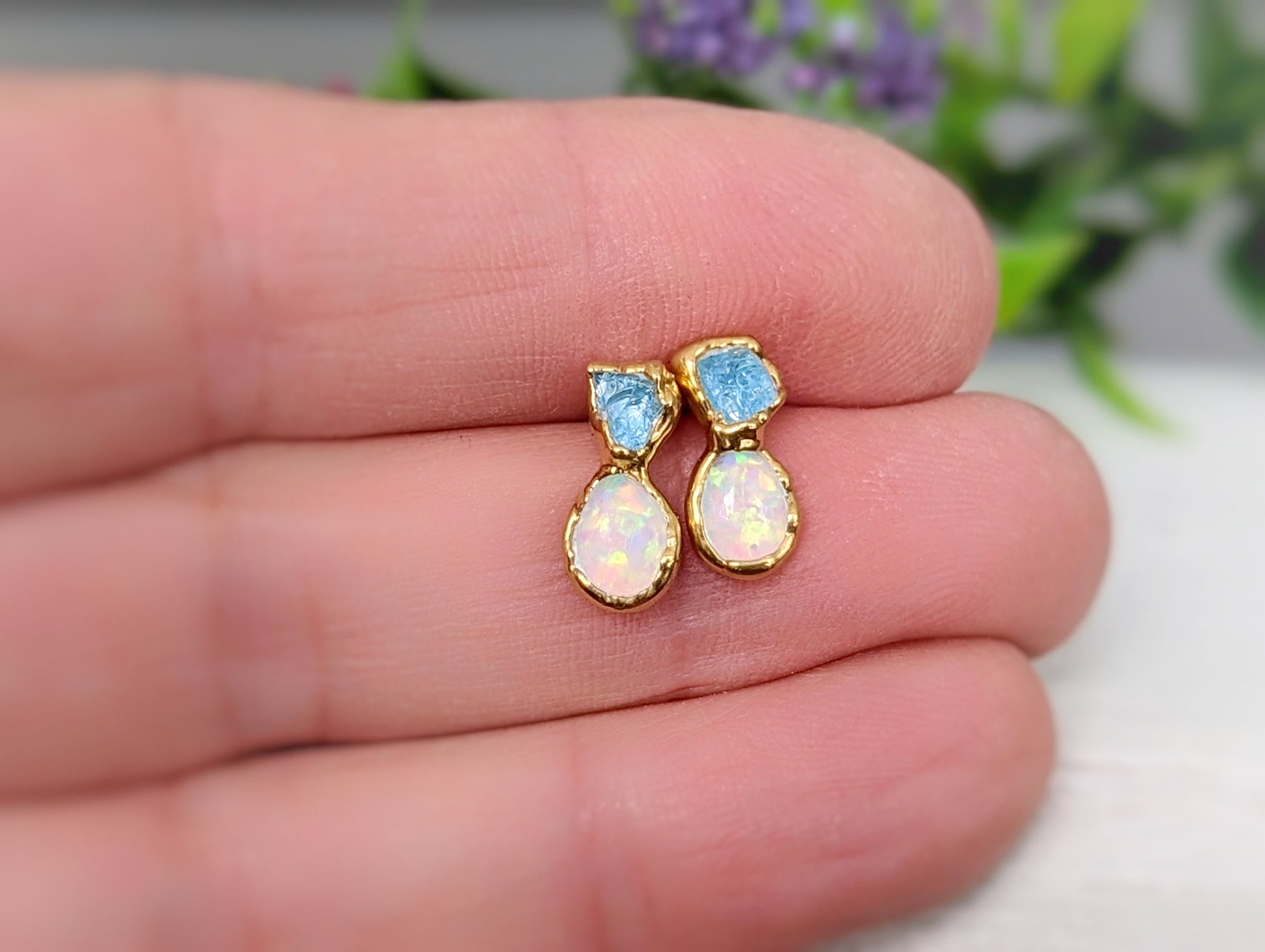 Aquamarine and Opal stud earrings, handcrafted bridal jewelry, showcasing delicate hues and unique design.
