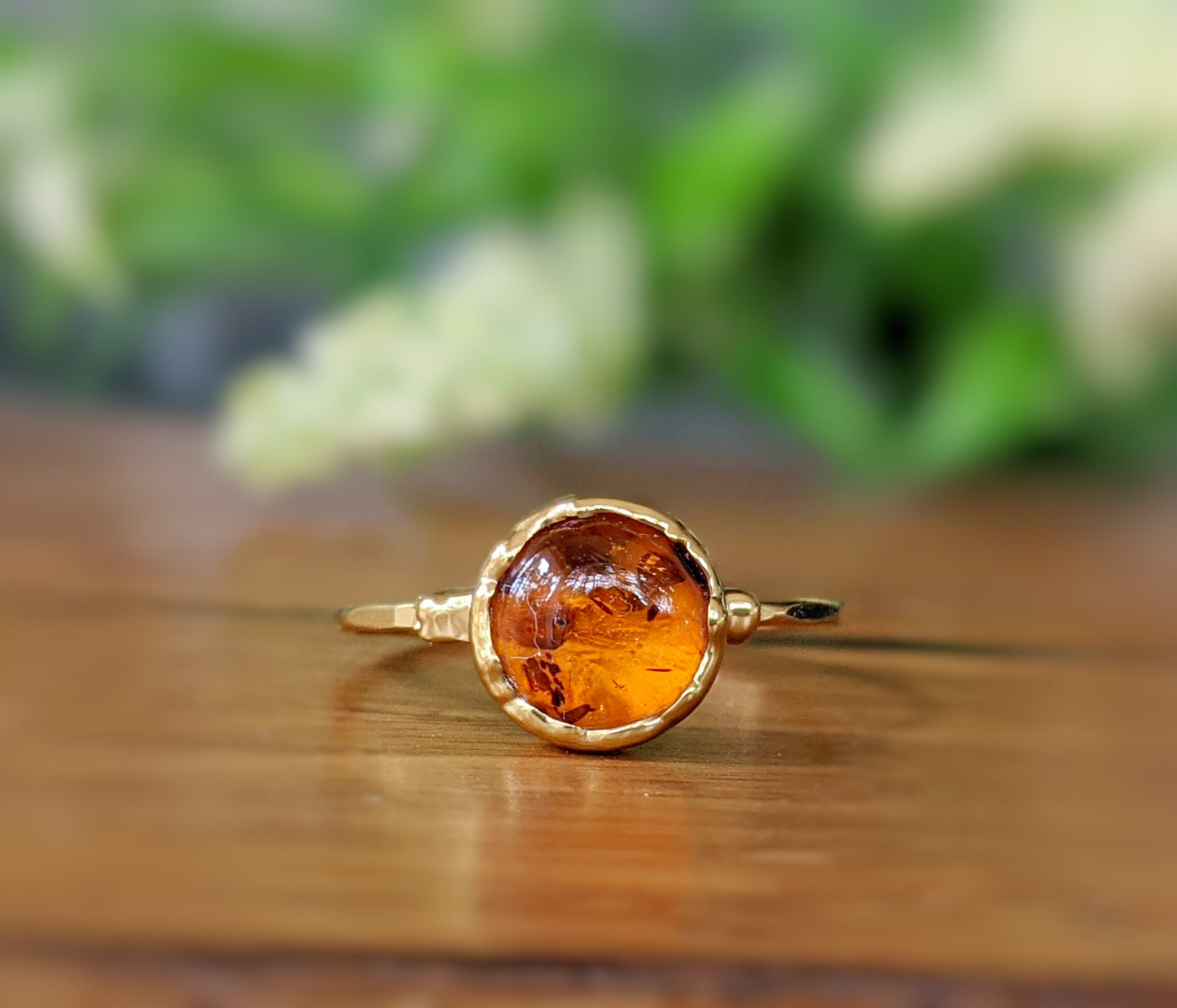 Natural Baltic Amber gold ring featuring an 8mm round stone on a 14k hammered gold filled band.