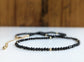 Elegant black spinel bead necklace with golden accents, perfect for any occasion or gift.