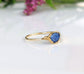 Blue rose-cut Kyanite stone set in a solid 14k gold band, showcasing a unique and elegant design.