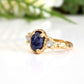 Blue Sapphire and diamond engagement ring in 14k gold with unique textured design, showcasing a stunning sapphire and raw diamonds.