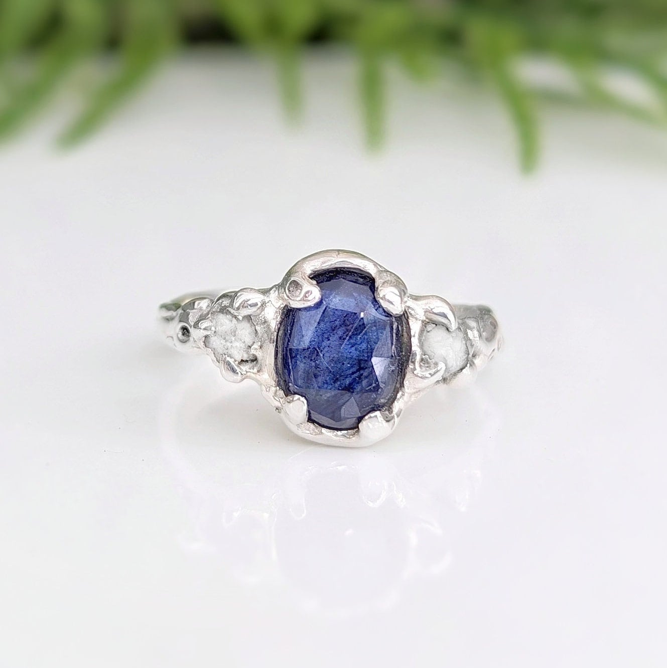 Blue Sapphire and raw diamond engagement ring in solid sterling silver with textured design.