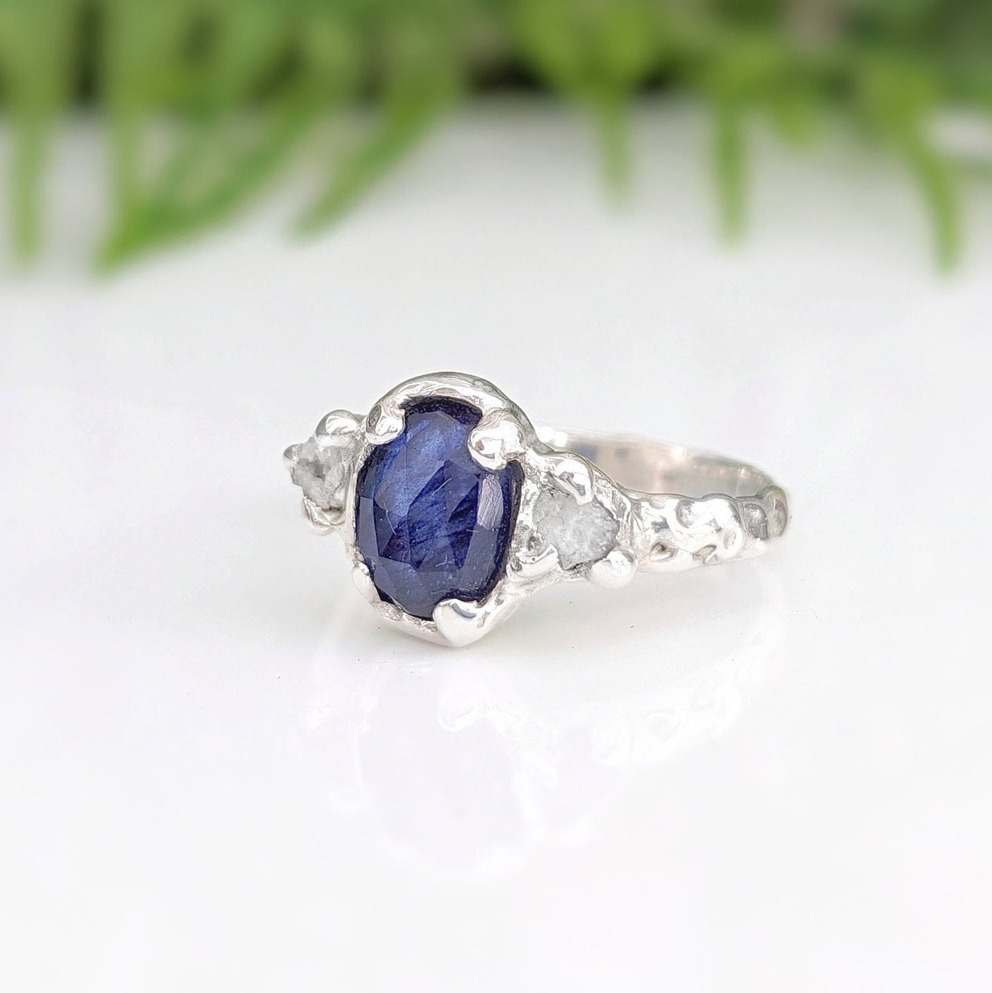 Blue Sapphire and raw diamond engagement ring in solid sterling silver, showcasing unique hand-carved design and natural elegance.