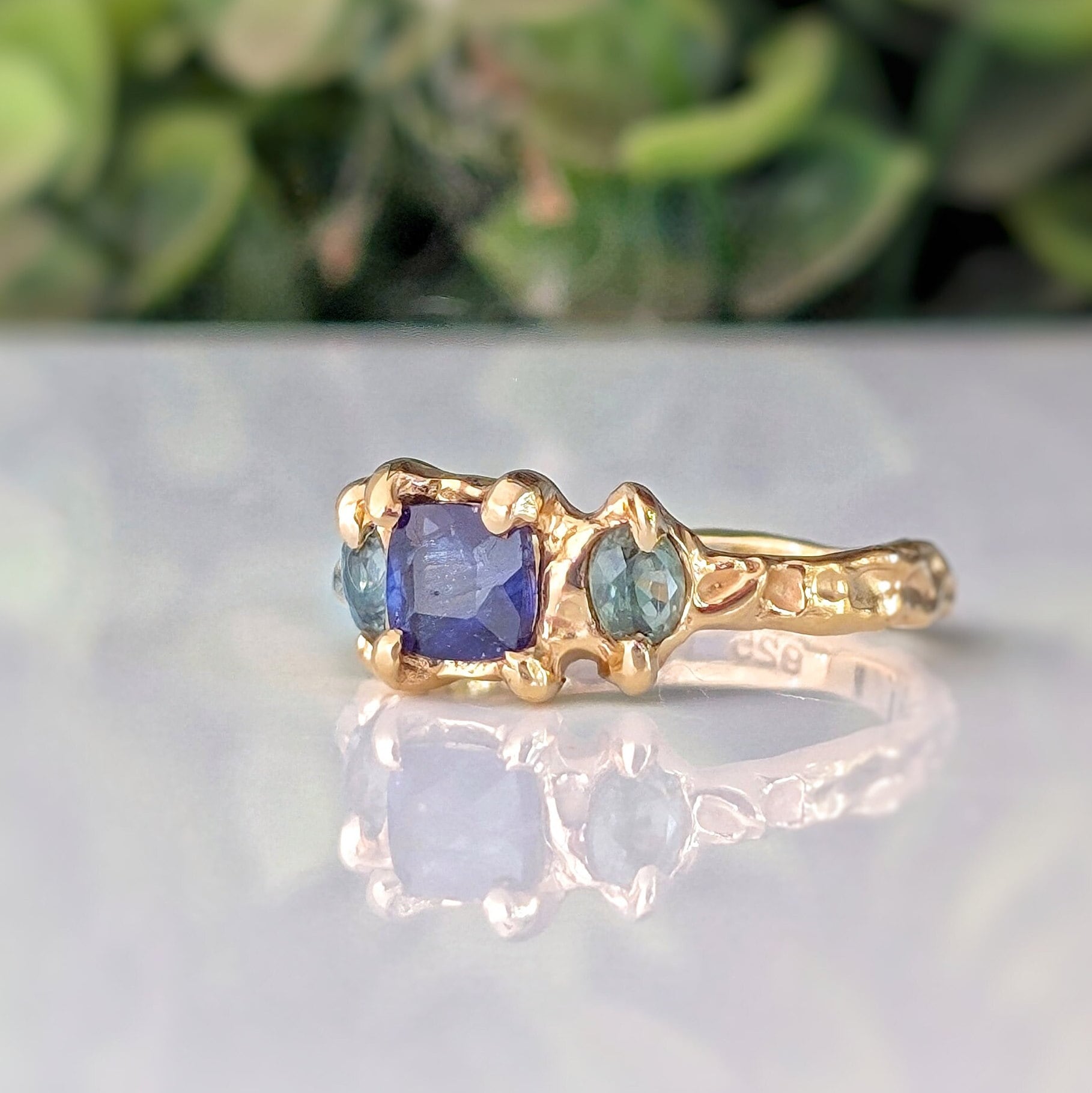 Blue Sapphire and Tourmaline engagement ring in Solid 14k Gold with rustic texture and unique design.