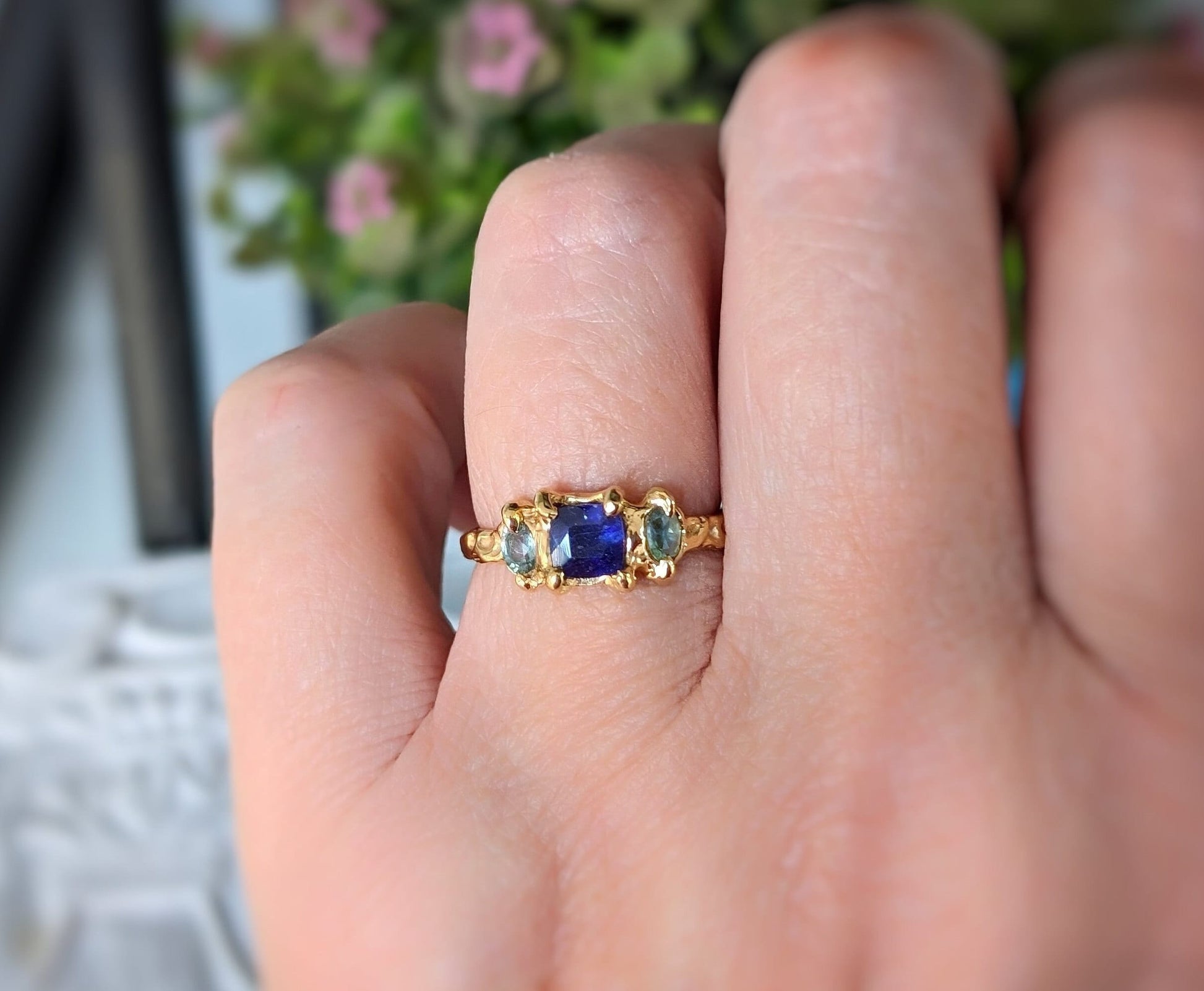Elegant Blue Sapphire and Tourmaline engagement ring in Solid 14k Gold, showcasing a unique handcrafted design.