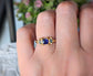Elegant Blue Sapphire and Tourmaline engagement ring in Solid 14k Gold, showcasing a unique handcrafted design.