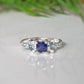 Elegant Blue Sapphire and Tourmaline engagement ring in Solid 14k Gold with organic texture.