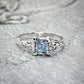 Handcrafted London Blue Topaz engagement ring in solid sterling silver with an organic textured band.