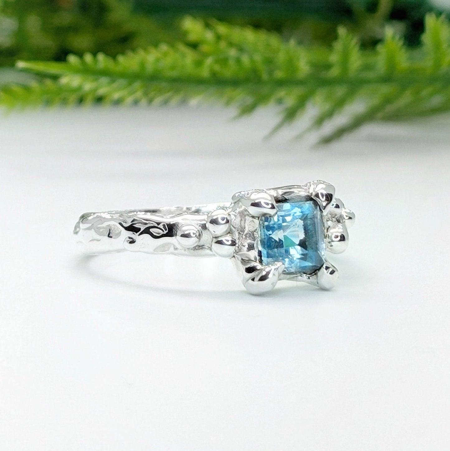 London Blue Topaz engagement ring in solid sterling silver with organic textured band.