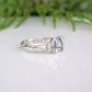 Handcrafted London Blue Topaz engagement ring in solid sterling silver with an organic textured band.