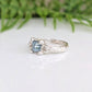 London Blue Topaz engagement ring in sterling silver with an organic textured band.