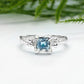 Handcrafted London Blue Topaz engagement ring in solid sterling silver with an organic textured band.