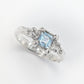 Handcrafted London Blue Topaz engagement ring in textured sterling silver, featuring a stunning blue crystal centerpiece.