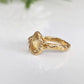 Handcrafted solid 14k gold Citrine engagement ring with pear-shaped yellow crystal and textured organic band.