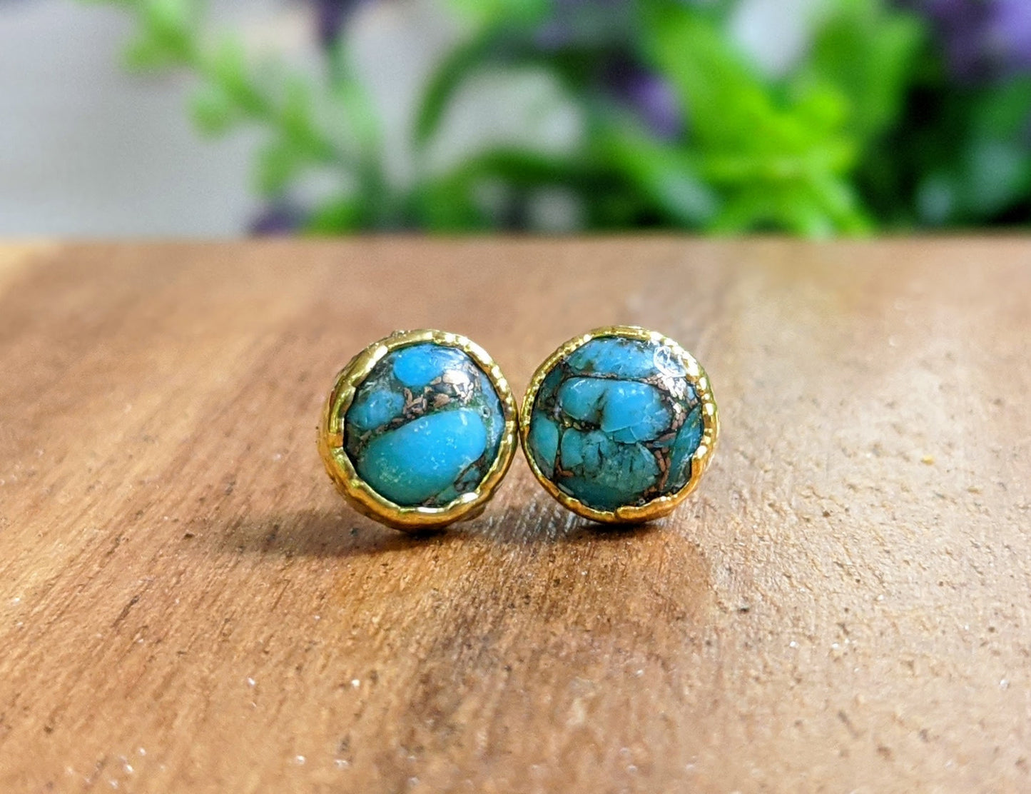 Turquoise stud earrings featuring 10mm round copper stones set in 14k gold filled posts, classic and elegant design.
