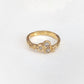 Cubic Zirconia cluster ring in solid 14k gold, featuring an organic textured band and sparkling stones.