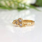 Cubic Zirconia cluster ring in solid 14k gold with organic textured band and sparkling stones.