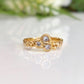 Cubic Zirconia cluster ring in Solid 14k Gold, featuring three sparkling stones on an organic textured band.