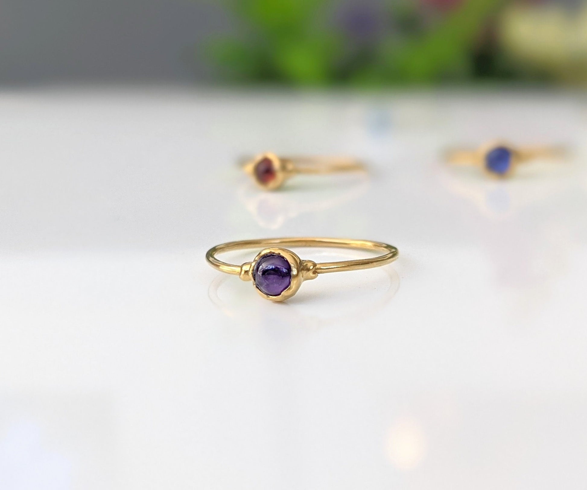 Dainty Amethyst stacking ring with 4mm natural purple gemstone on a gold-filled band, perfect for minimalist jewelry lovers.