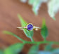 Dainty amethyst stacking ring with 4mm natural purple gemstone and gold-filled band, perfect for everyday wear.