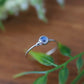 Dainty silver ring featuring a natural moonstone gemstone, perfect for stacking or everyday wear.