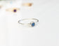 Dainty silver ring featuring a natural blue gemstone, perfect for stacking or as a minimalist everyday piece.