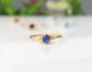 Dainty sapphire stacking ring with natural blue gemstone on a gold-filled band, perfect for everyday wear.