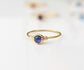 Dainty sapphire stacking ring with a 4mm natural blue sapphire set in a 14k gold filled band. Minimalist jewelry.