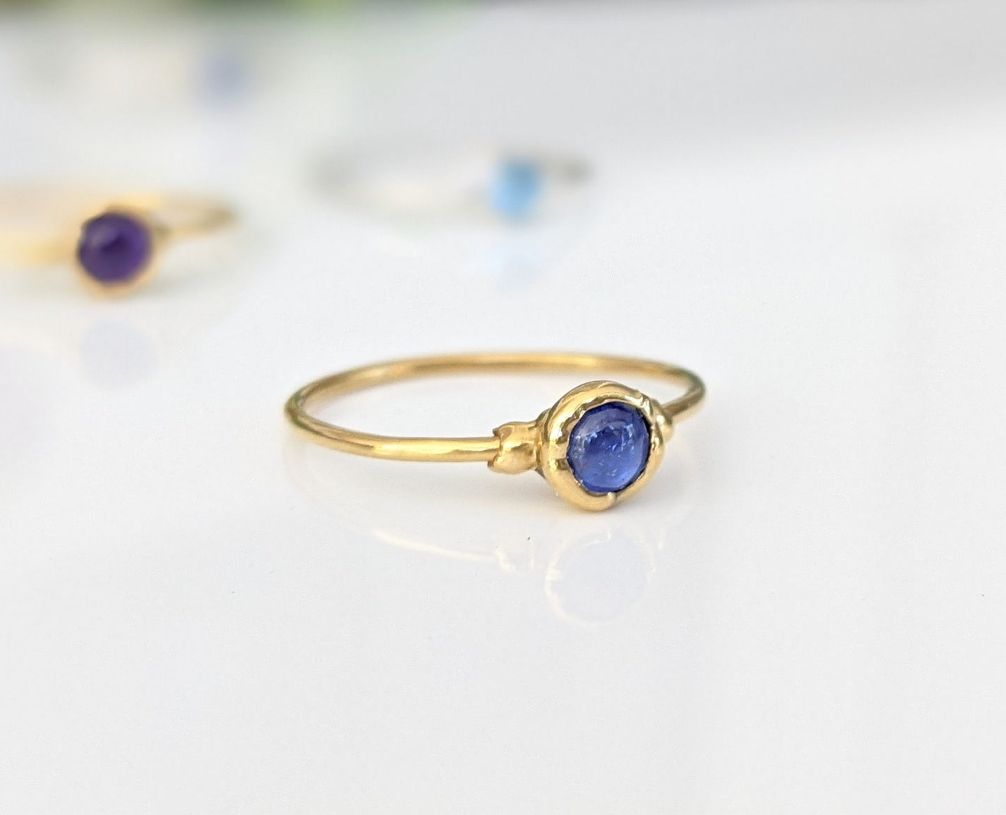 Dainty Sapphire stacking ring with a 4mm natural blue Sapphire gemstone set on a 14k gold filled band.