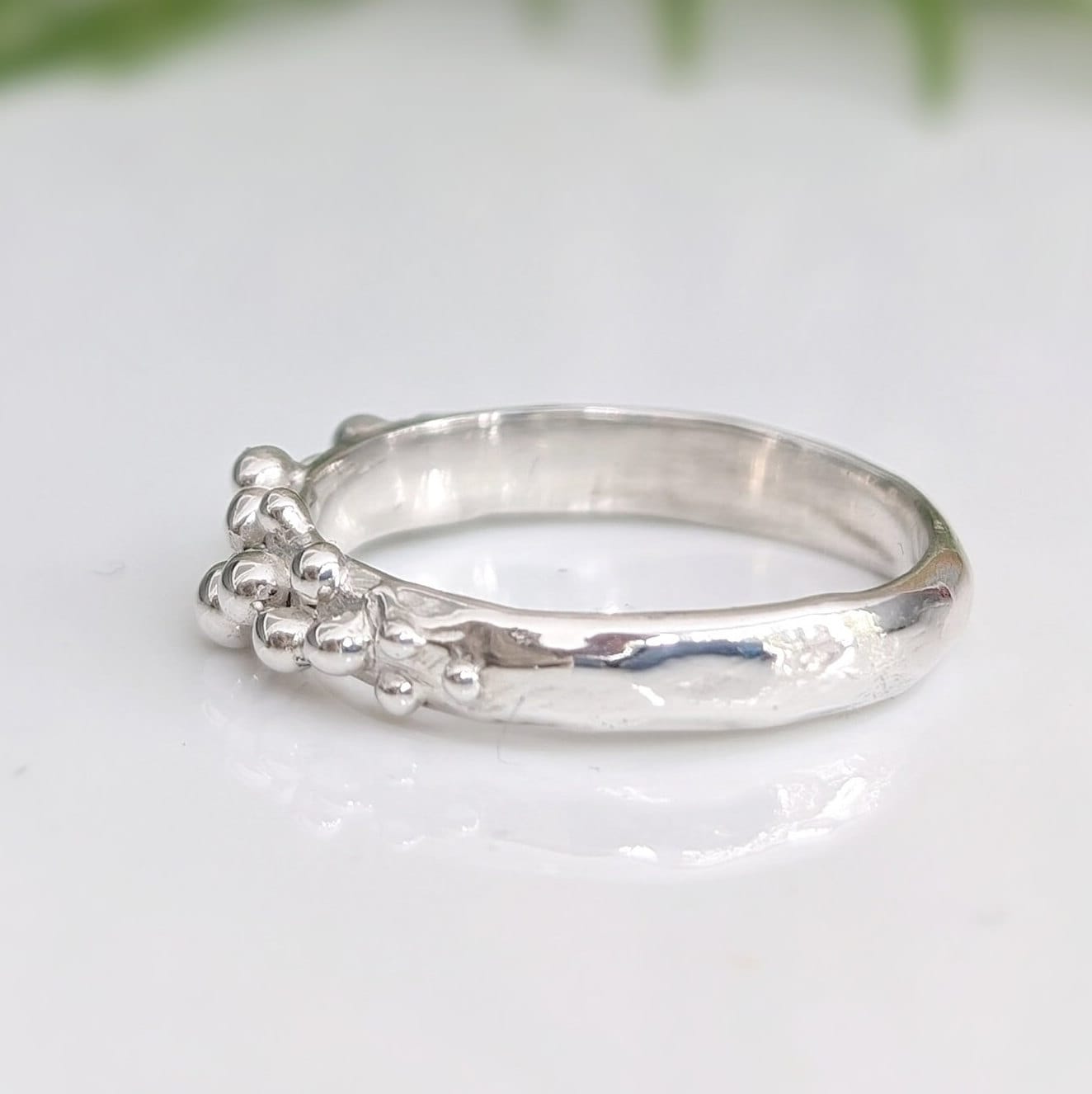 Dew Drop textured silver ring with beaded details, showcasing handcrafted imperfections and unique design.