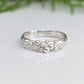 Dew Drop beaded textured silver ring showcasing unique handcrafted design with irregular abstract form.