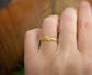 Solid gold molten beaded Dew Drop ring worn on a hand, showcasing its unique organic design and luxury craftsmanship.
