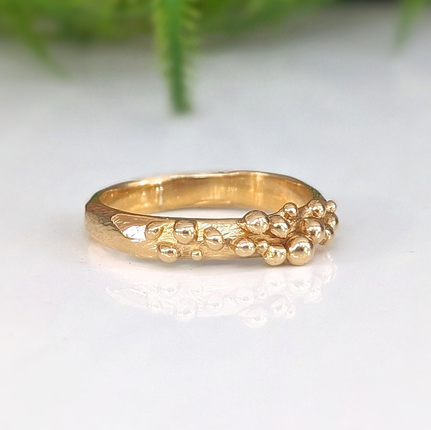 Solid gold Dew Drop beaded molten ring showcasing organic abstract design and unique handcrafted details.