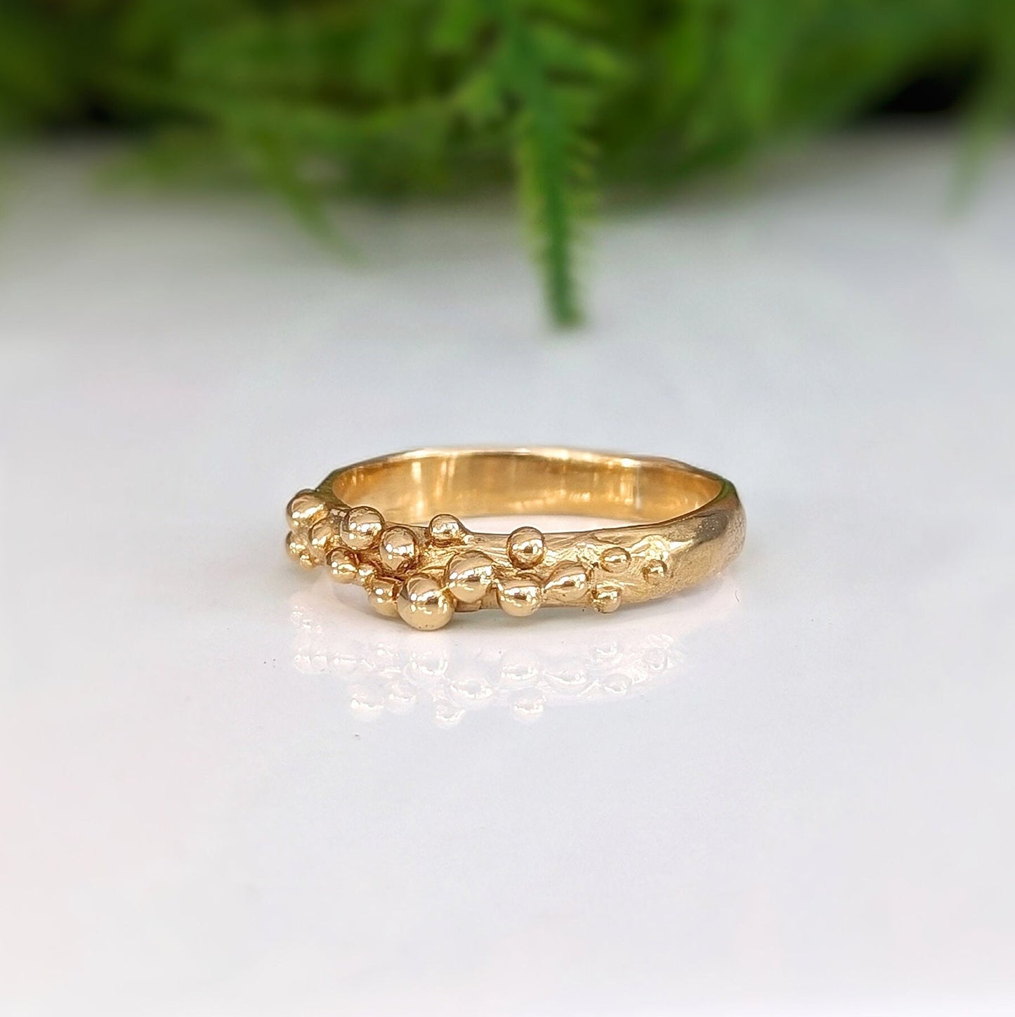 Handcrafted Solid Gold beaded Molten ring with organic design, representing untamed beauty and individuality.