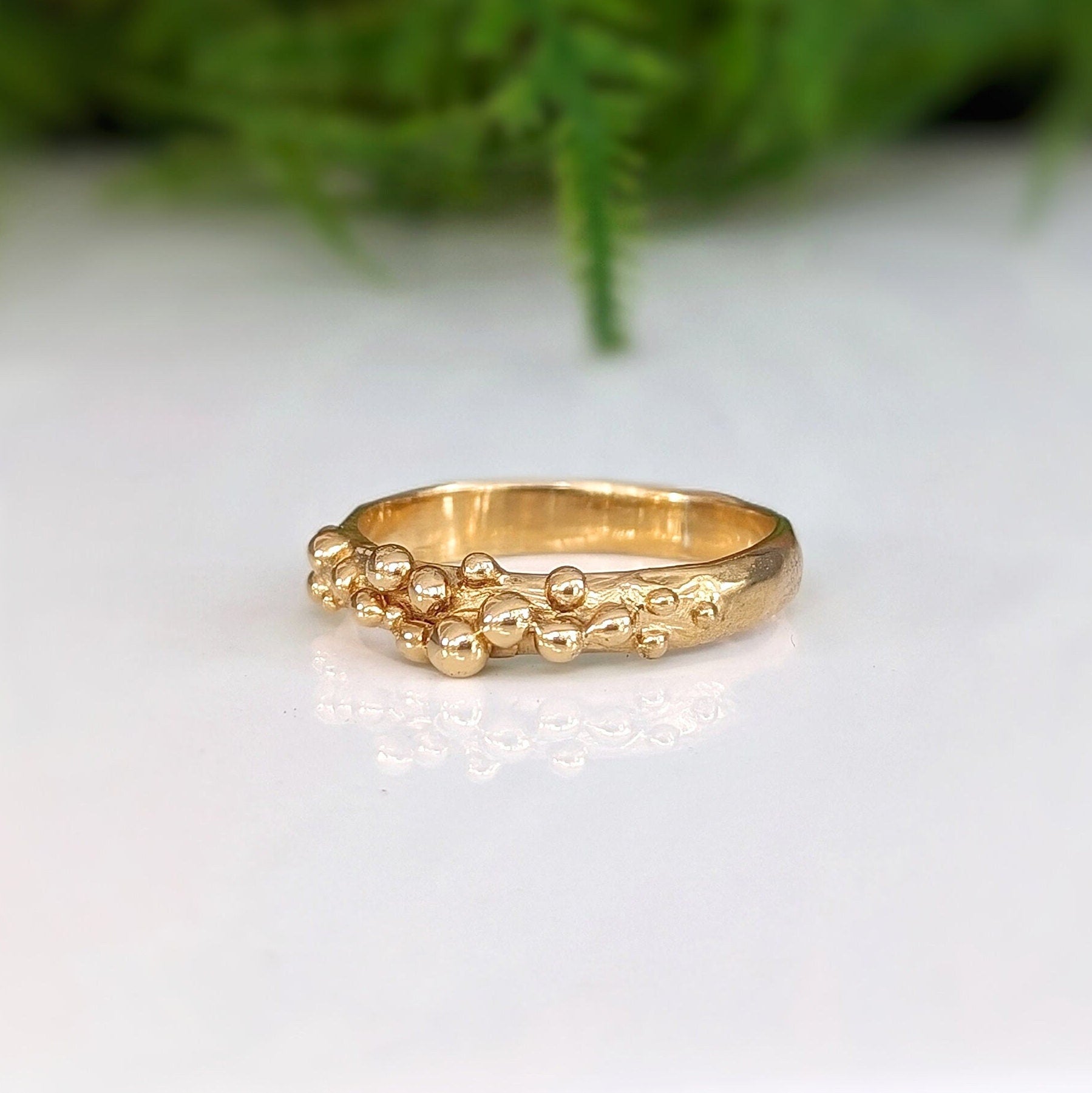 Handcrafted Solid Gold beaded Molten ring with organic design, representing untamed beauty and individuality.