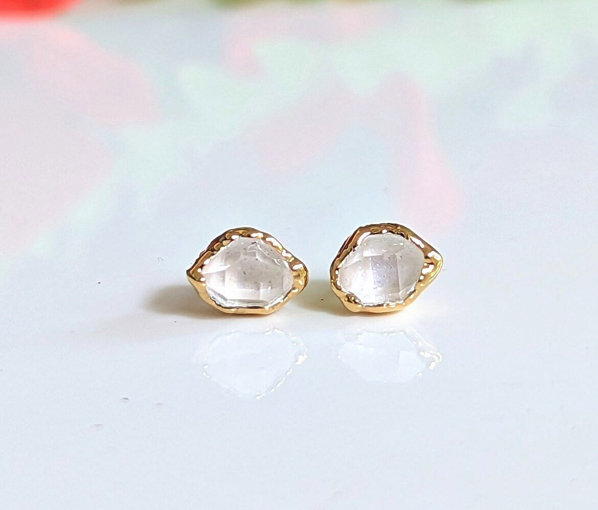 Herkimer diamond stud earrings with gold setting, showcasing unique crystal clarity, perfect for gifts and elegant wear.