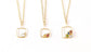 Family birthstone necklaces with square gold pendants and various raw gemstones, perfect for mothers.