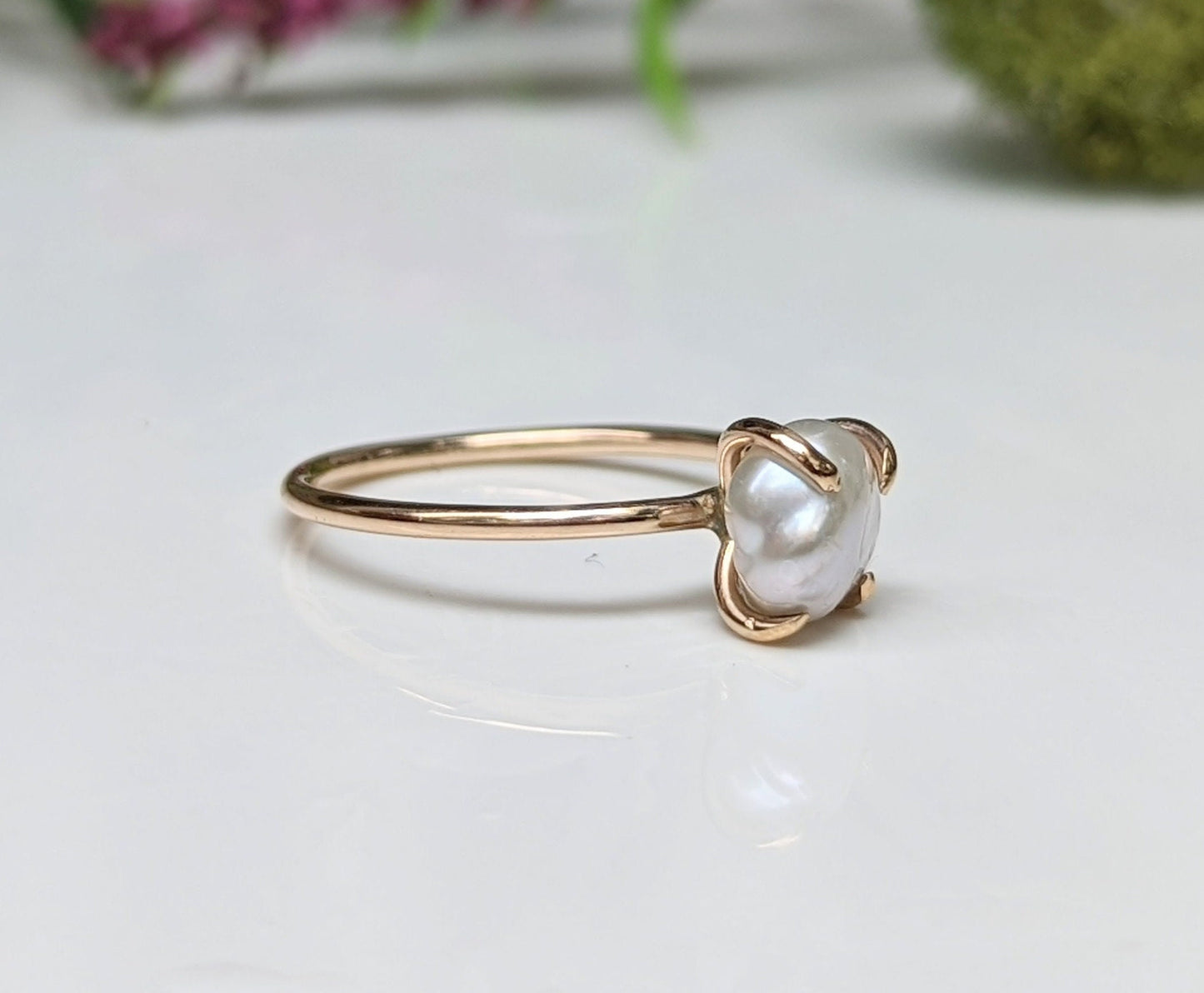 Freshwater Keshi pearl solitaire ring in 18k gold, showcasing unique handmade design and timeless elegance.