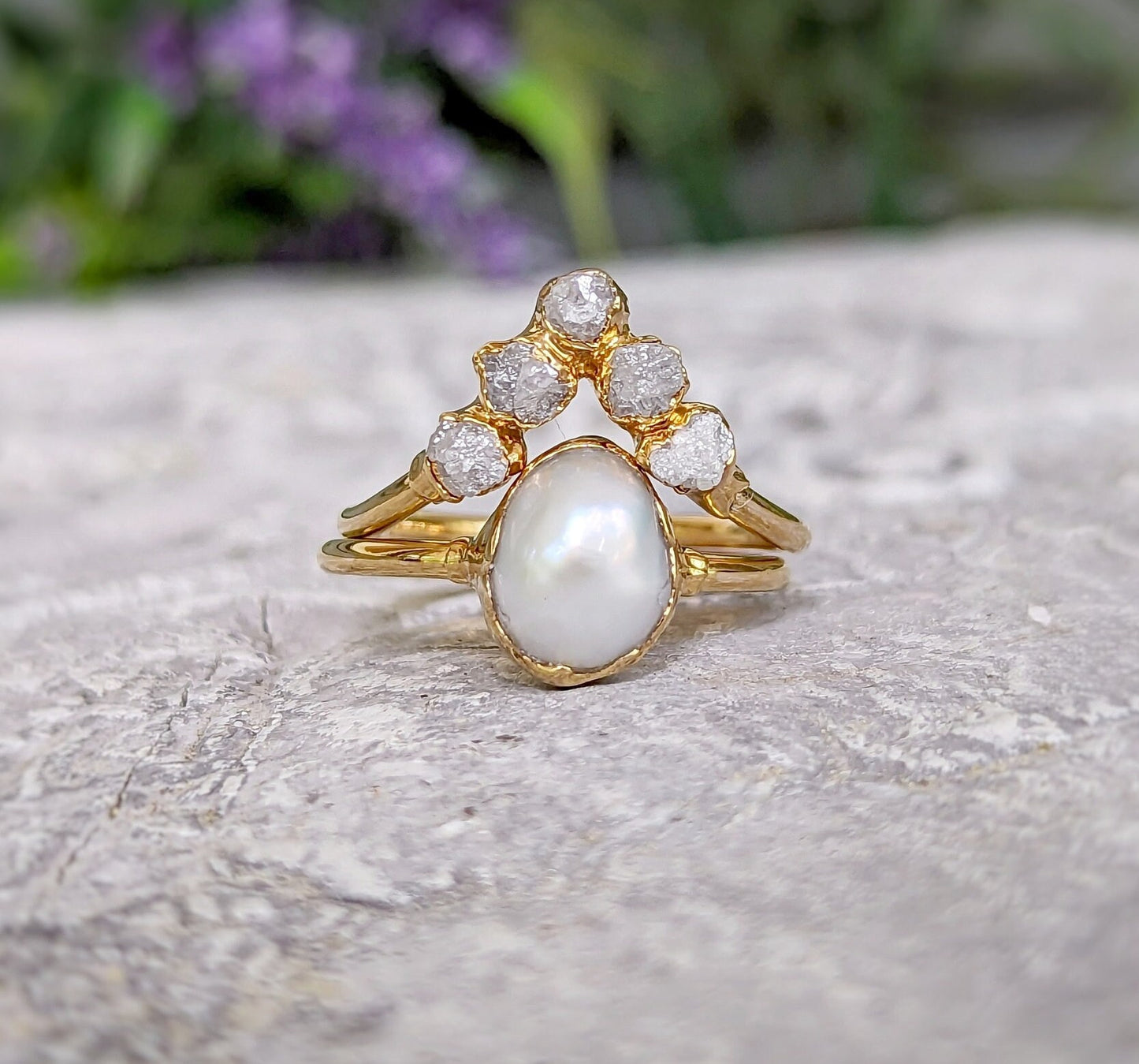 Freshwater pearl and raw diamond chevron wedding ring set in solid 14k gold, showcasing rustic elegance.