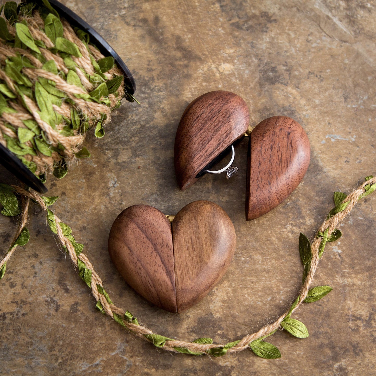 Heart-shaped wooden ring box for engagement or wedding rings, featuring a unique design and intricate details.