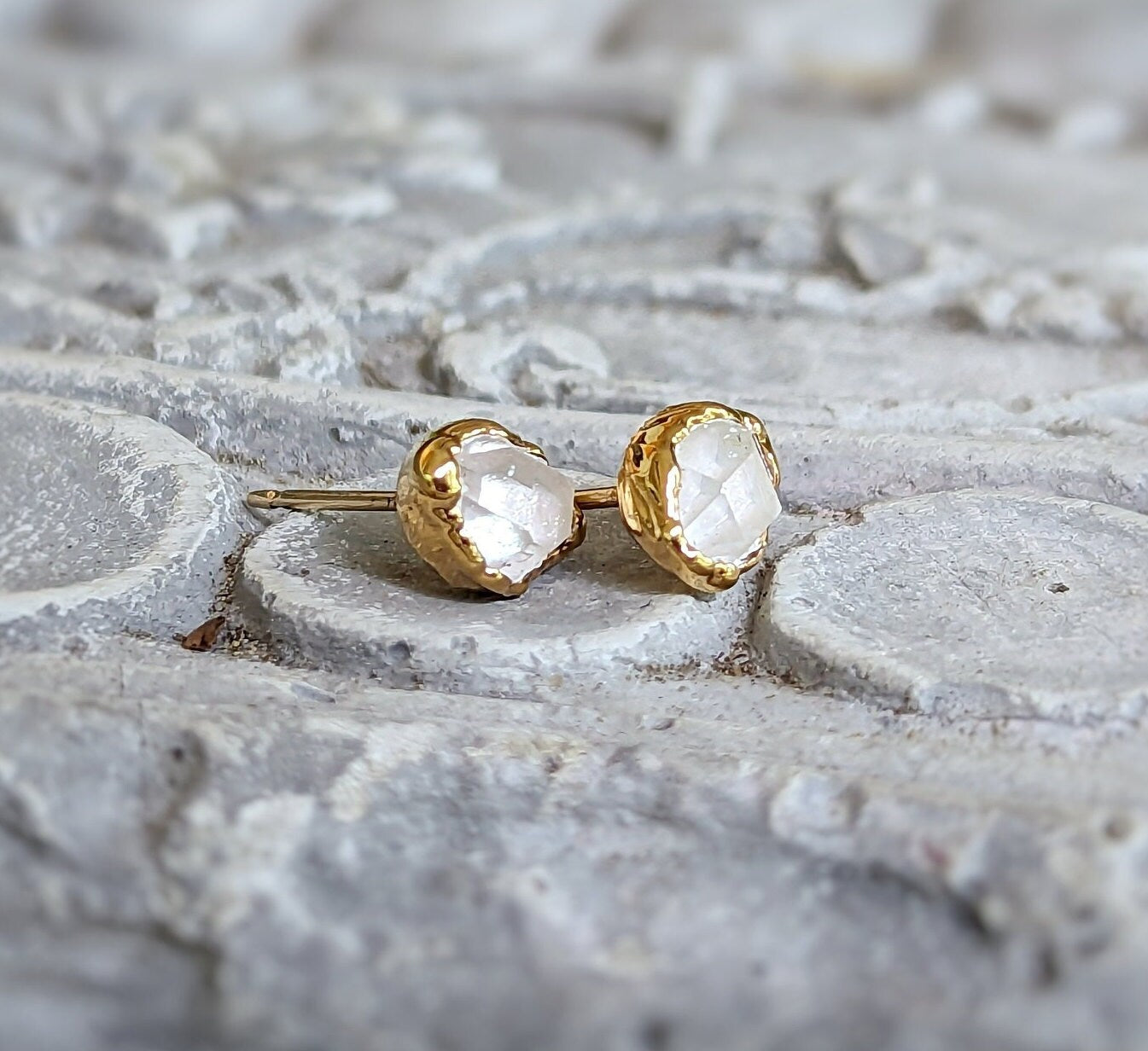 Herkimer diamond stud earrings in gold, featuring elegant crystal design, perfect for everyday wear or special occasions.