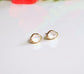 Handcrafted Herkimer diamond stud earrings in gold settings, perfect for bridal wear or as unique gifts.