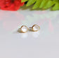 Elegant Herkimer diamond stud earrings with gold setting, perfect for bridal wear or unique gifts.