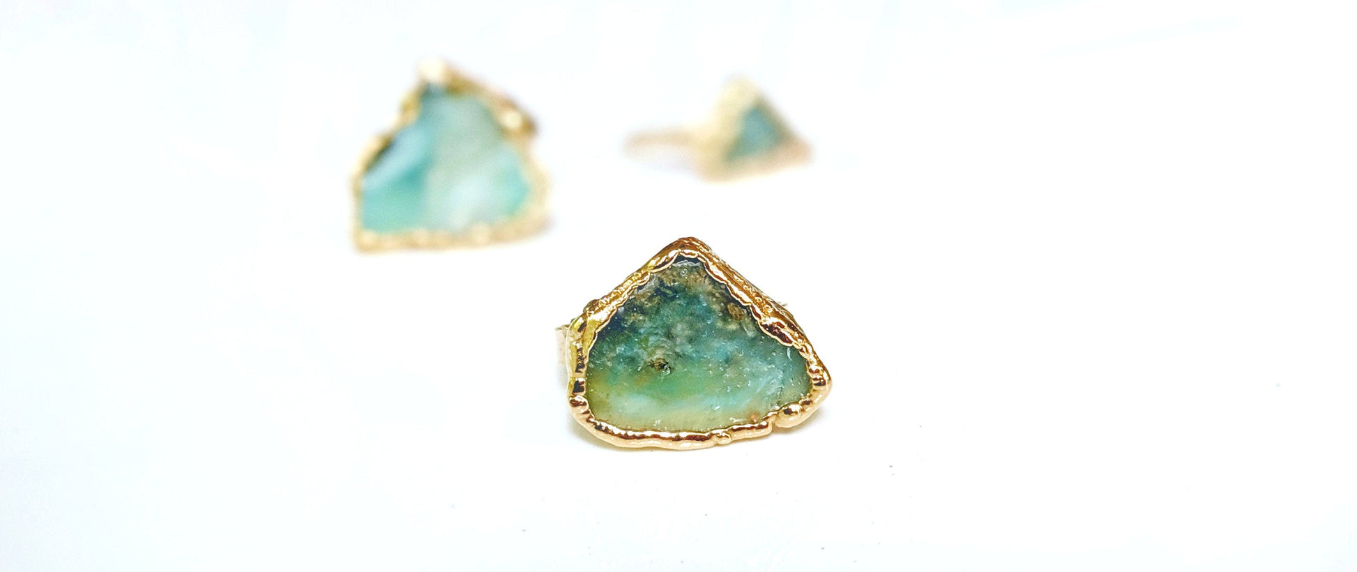 Handcrafted raw Peruvian opal ring with aqua blue stone on a gold filled band.